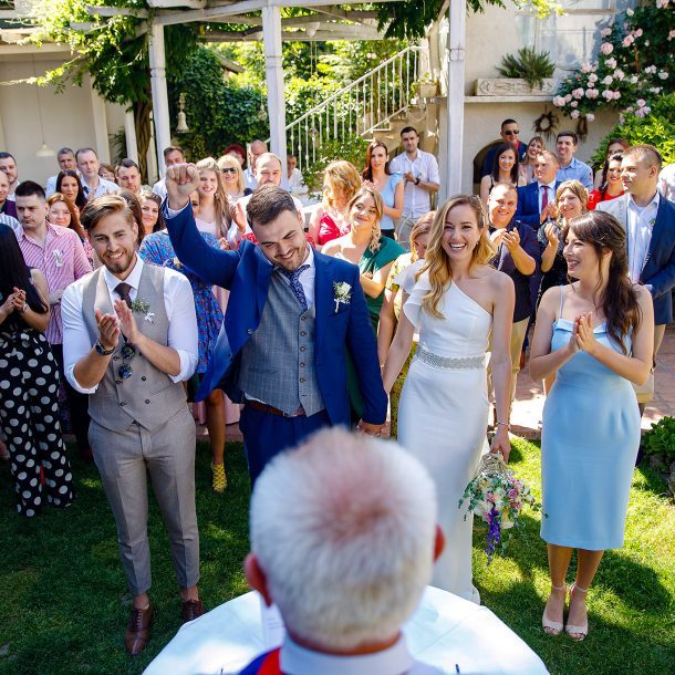 Bride and groom exchanging vows in front of the registrar
